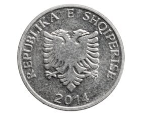 Albanian five lekë coin on a white background