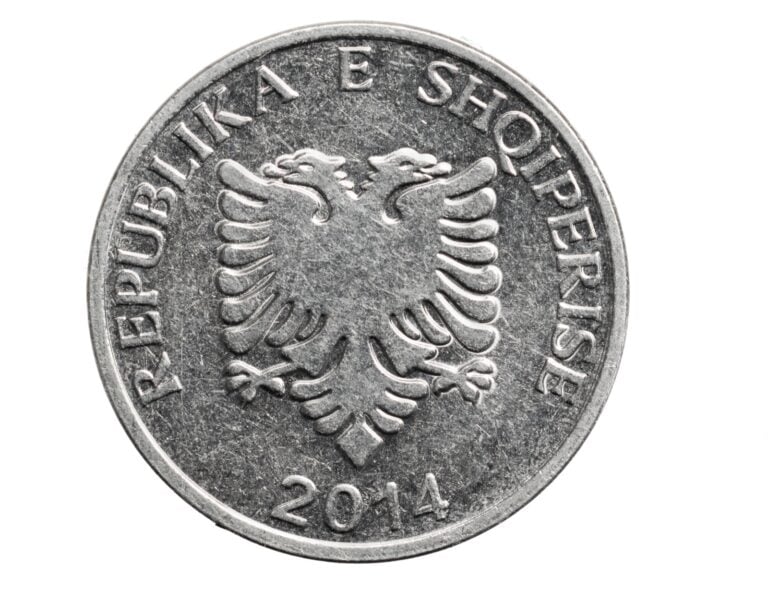 Albanian five lekë coin on a white background