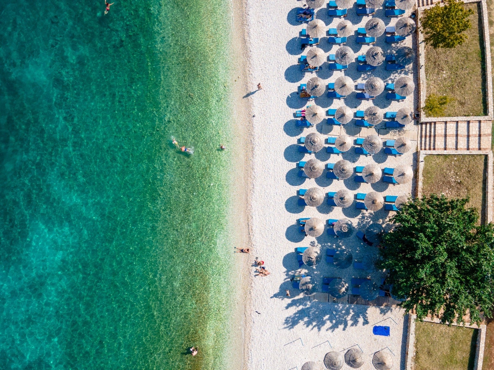 Aerial view of a beach with turquoise water