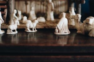 Carved figures arranged on a dark table