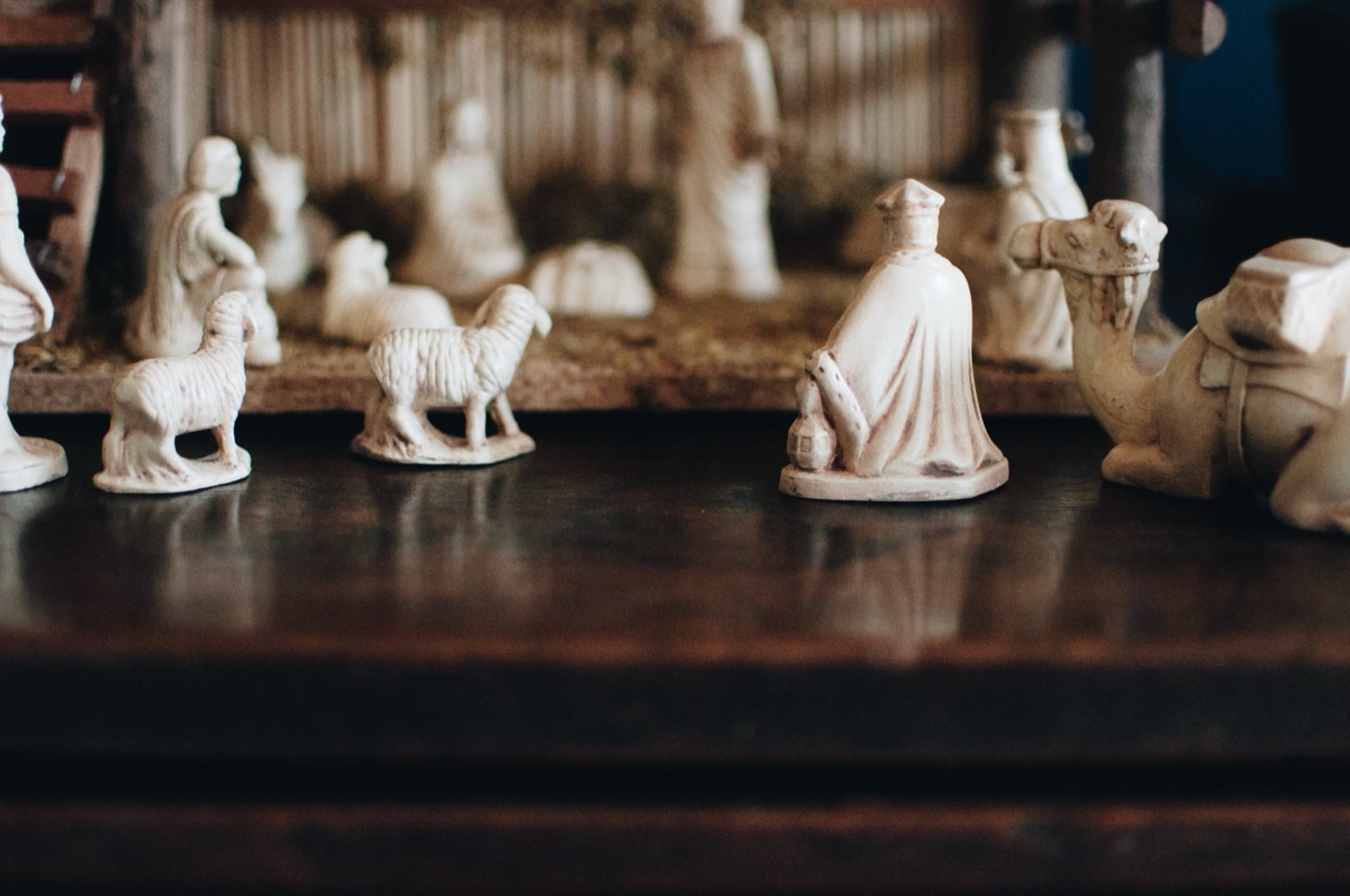 Carved figures arranged on a dark table